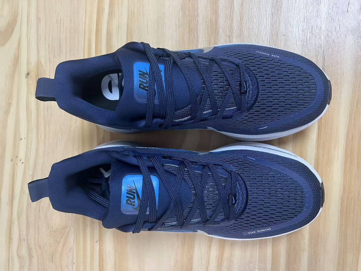 Navy and Blue Nike Vomero 18 Running Shoes - product image from the listing.