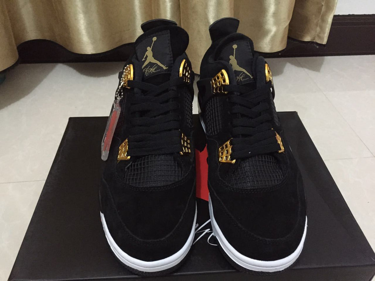 Jordan 4 High-Top Sneakers in Black and Gold - product image from the listing.