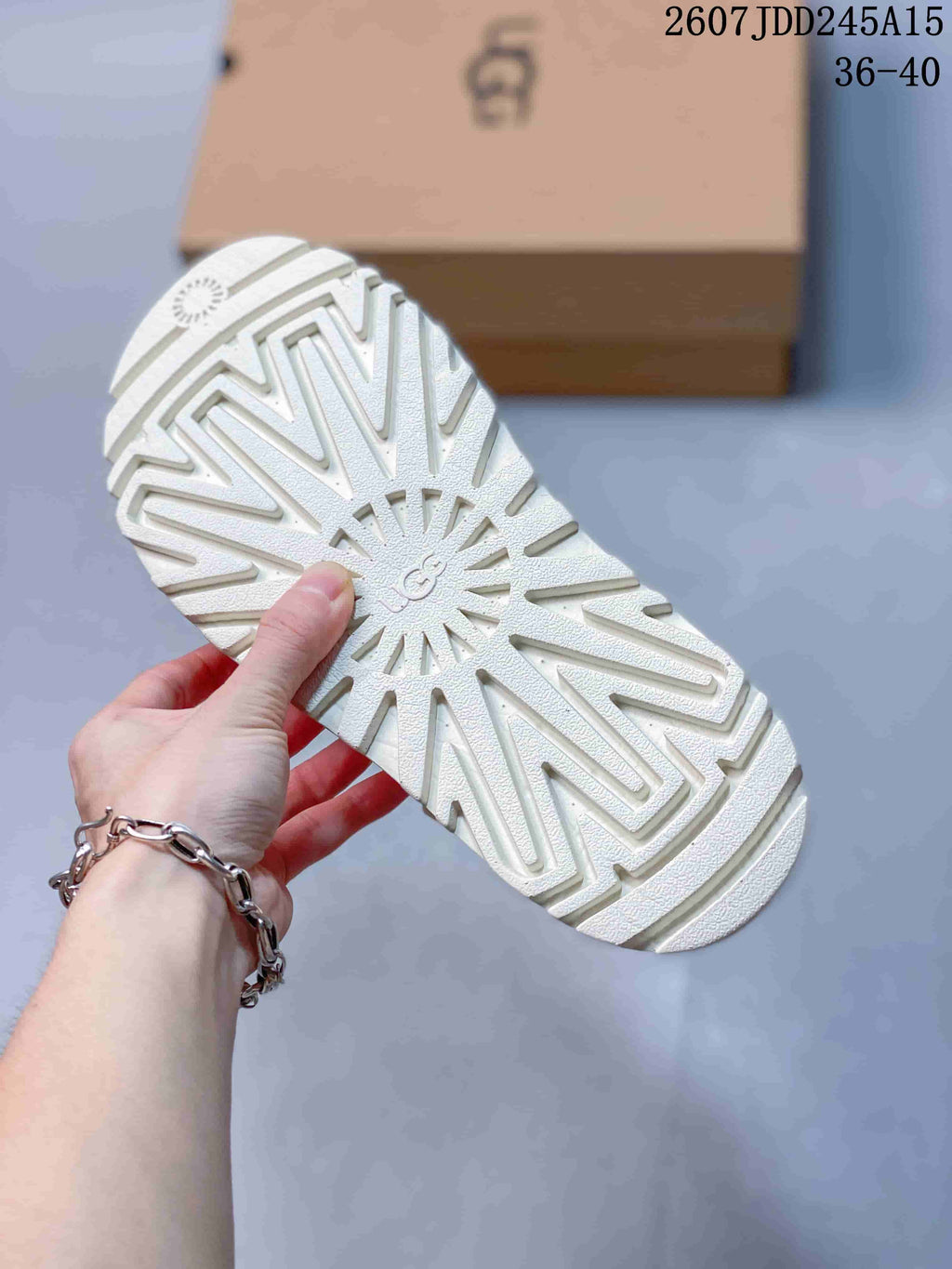White UGG GoldenGlow Slide Sandals - product image from the listing.