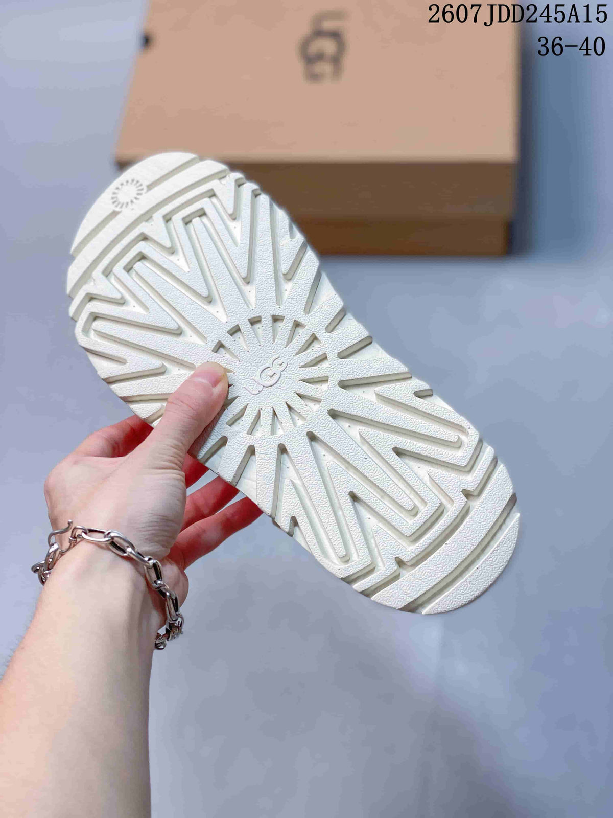 White UGG GoldenGlow Slide Sandals - product image from the listing.
