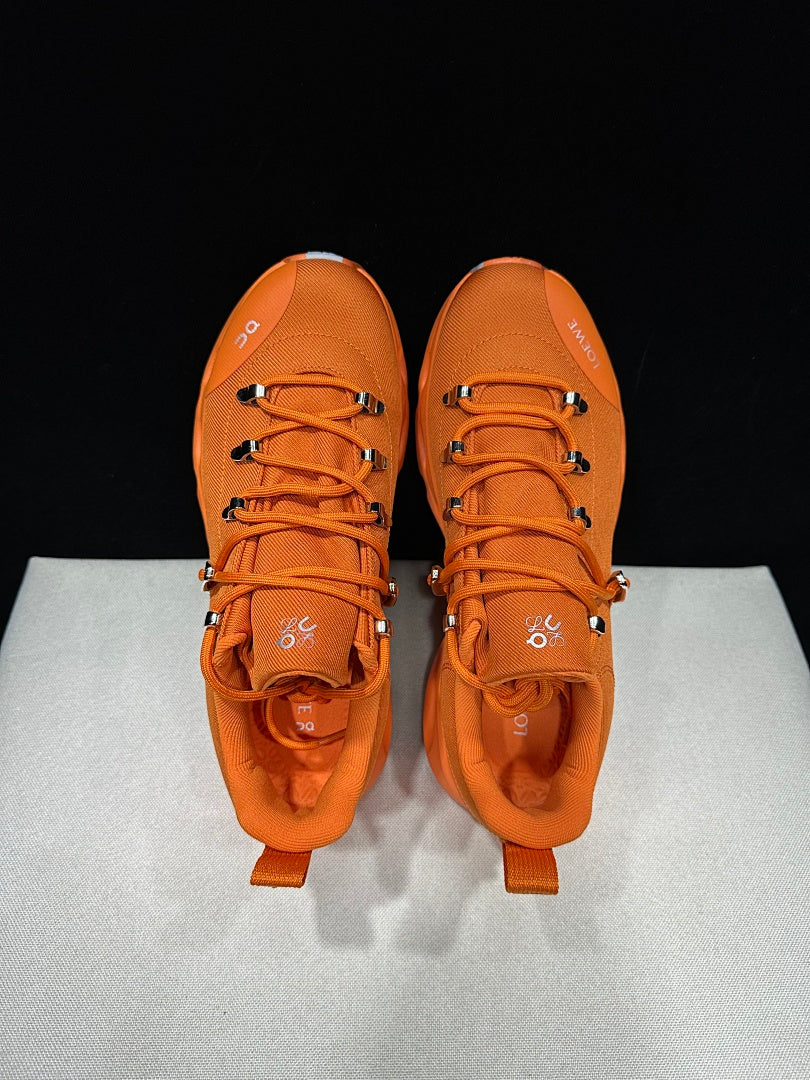 On x Loewe Cloudsurfer Orange Trail Trainers - product image from the listing.