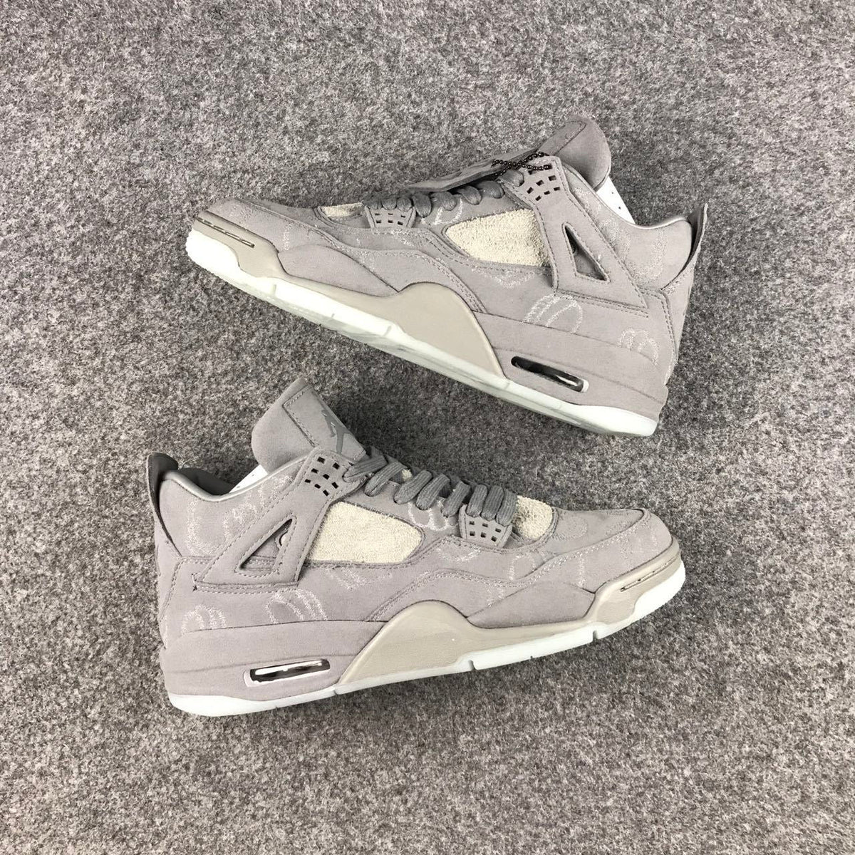 Grey Jordan 4 KAWS Sample High-Top Sneakers - product image from the listing.
