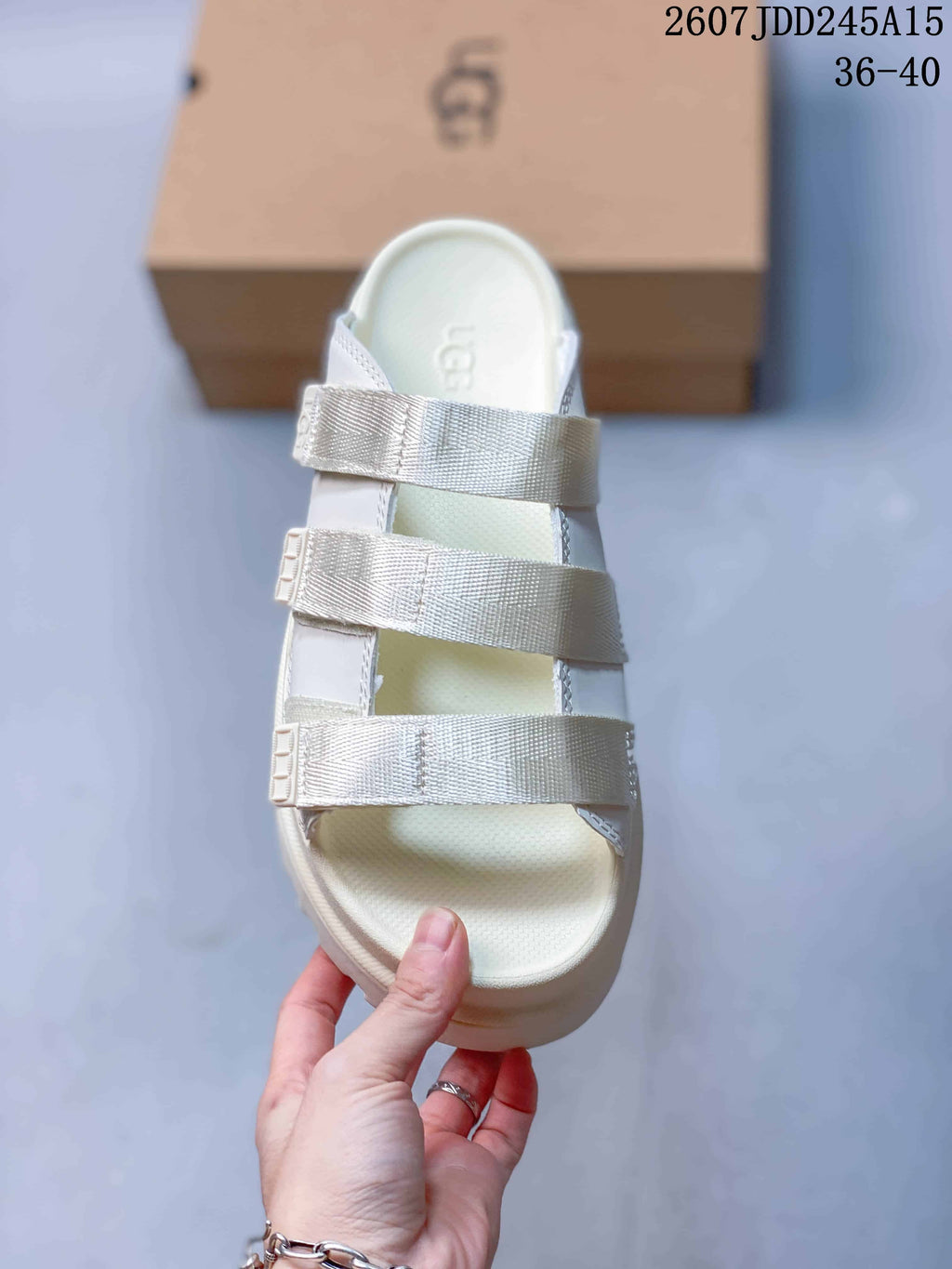 White UGG GoldenGlow Slide Sandals - product image from the listing.