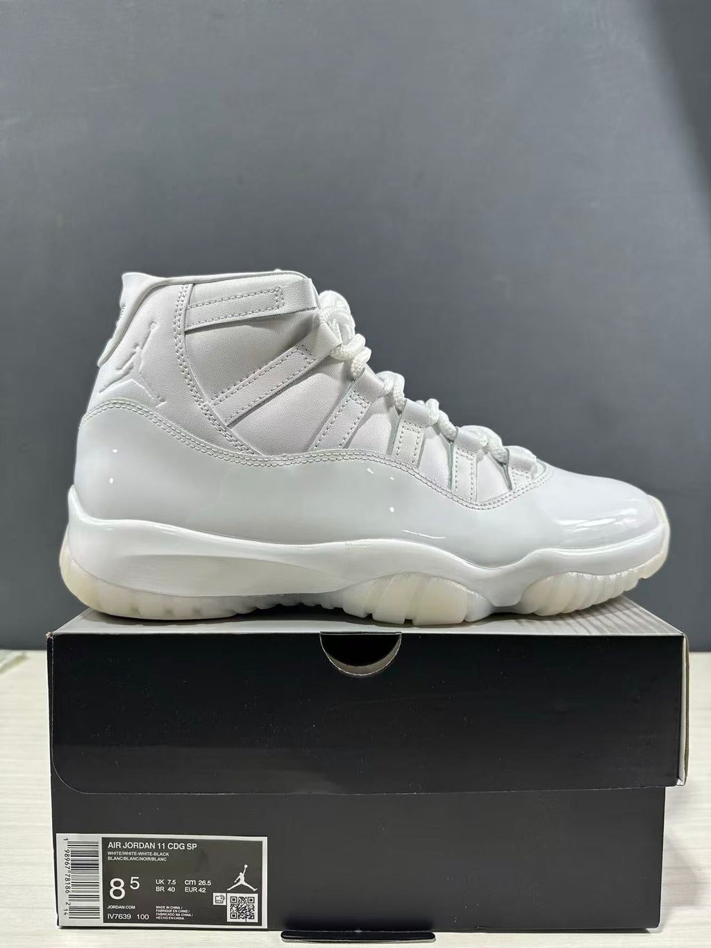 Air Jordan 11 Comme des Garçons White Sneakers IV7639-100 - product image from the listing.