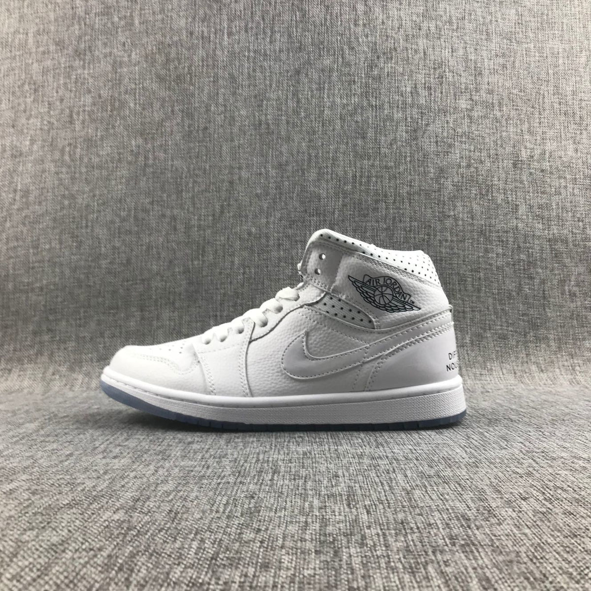 Air Jordan 1 Mid Unite Totale Sneakers in White CI9100-100 - product image from the listing.