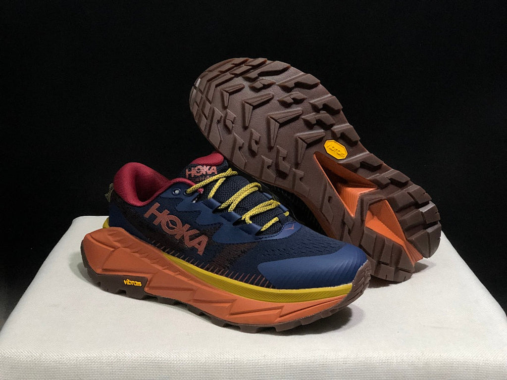 HOKA Skyline Float X Trail Sneakers in Navy Orange - product image from the listing.