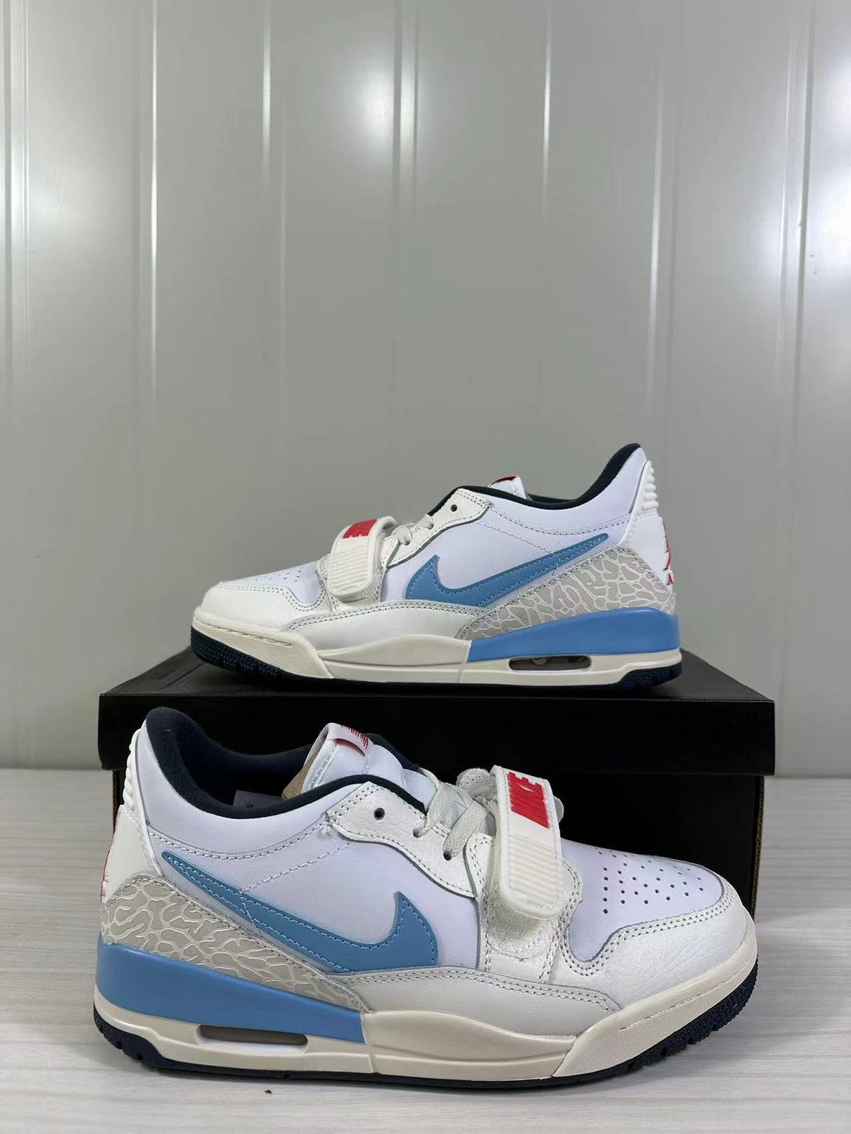Jordan Legacy 312 Low in White Blue Red HM3709-141 - product image from the listing.