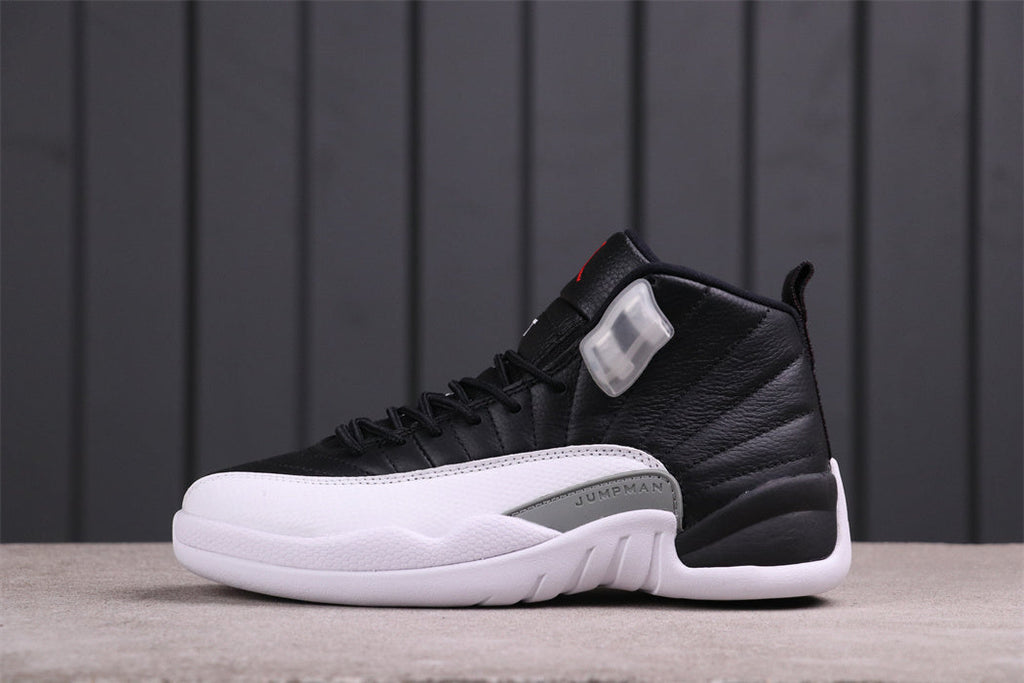 Air Jordan 12 Reverse Taxi Black White 130690-001 - product image from the listing.