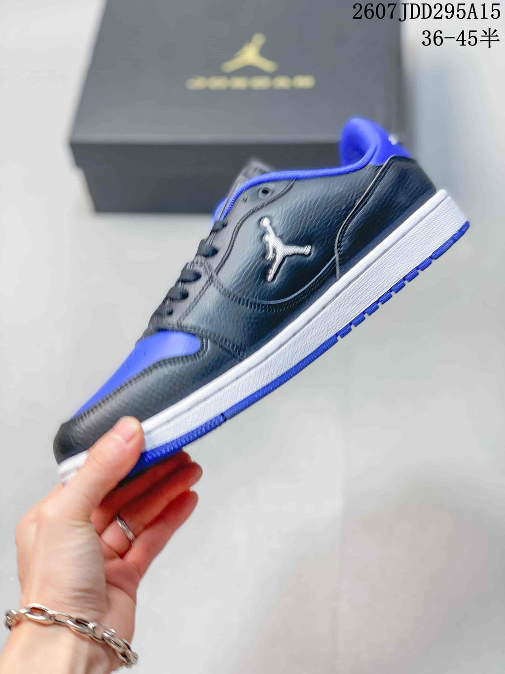 Air Jordan 1 Low Black Blue White Sneakers - product image from the listing.