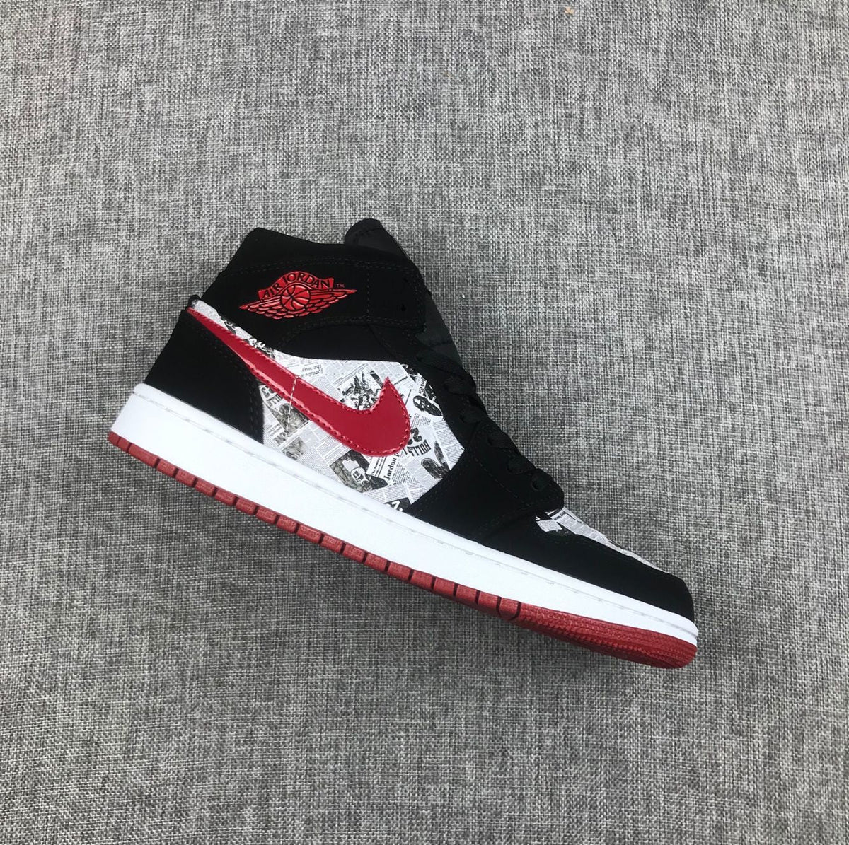 Air Jordan 1 Mid Sneakers in Black Red 852542-061 - product image from the listing.