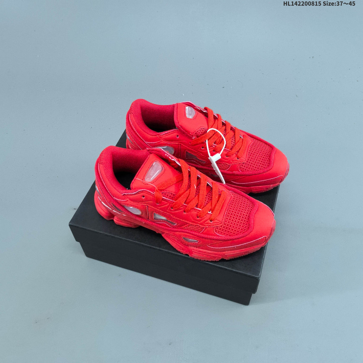 Raf Simons x adidas Ozweego III Retro Sneakers for Running - product image from the listing.