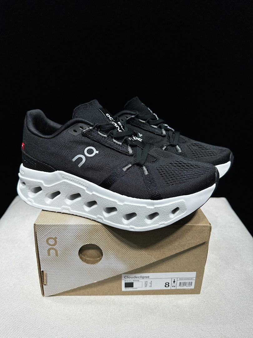 On CloudEclipse Running Shoes in Black and White - product image from the listing.