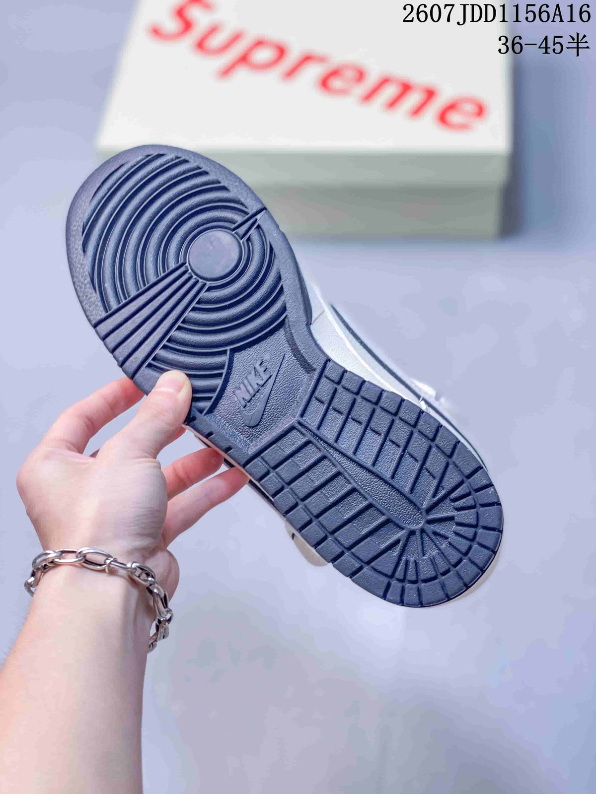 Nike SB Dunk Low Supreme Sneakers in Off-White - product image from the listing.