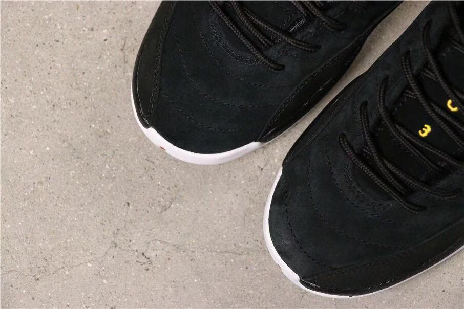 Air Jordan 12 Reverse Taxi Sneakers Black 153265-017 - product image from the listing.