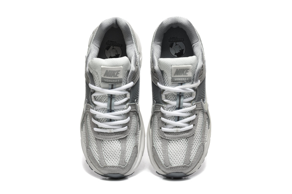 Grey and White Nike Vomero 5 Sneakers - product image from the listing.