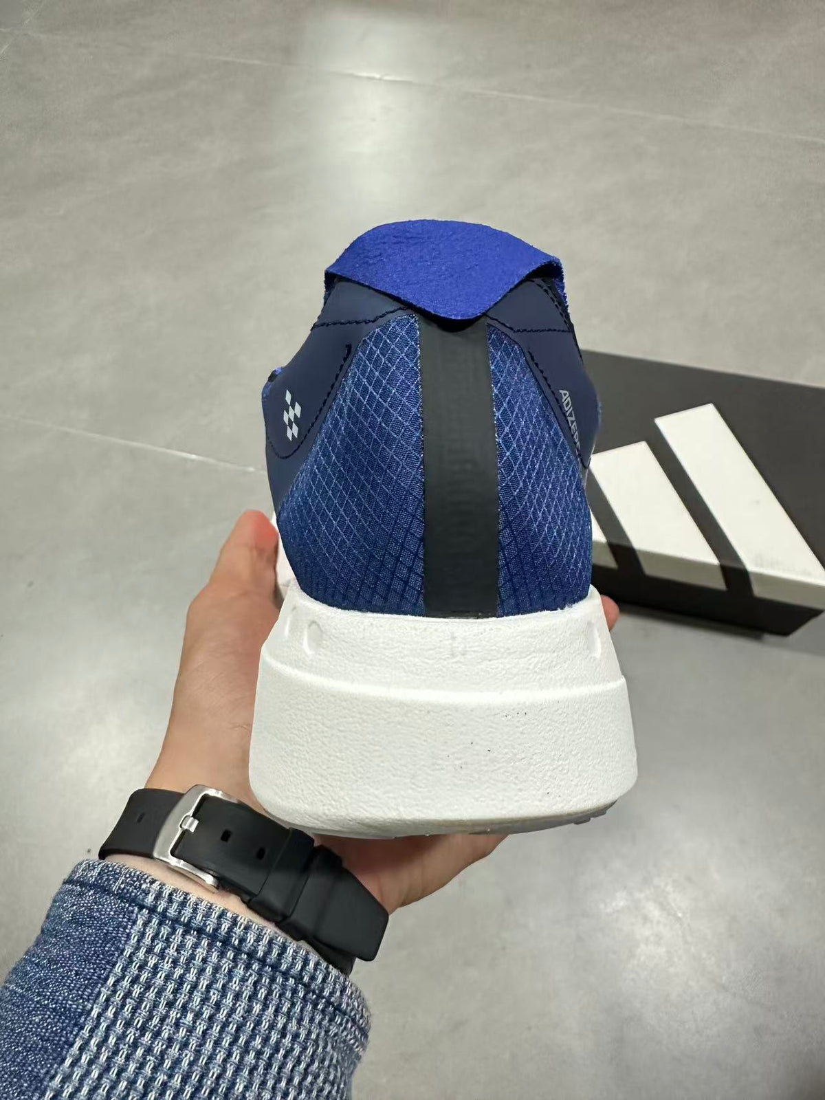 Nike Adizero Lightstrike Pro Running Shoes, in Navy and Orange - product image from the listing.
