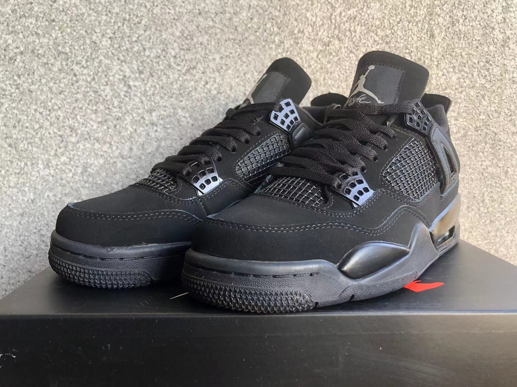 Jordan 4 Retro Black Cat Sneakers in Black - product image from the listing.