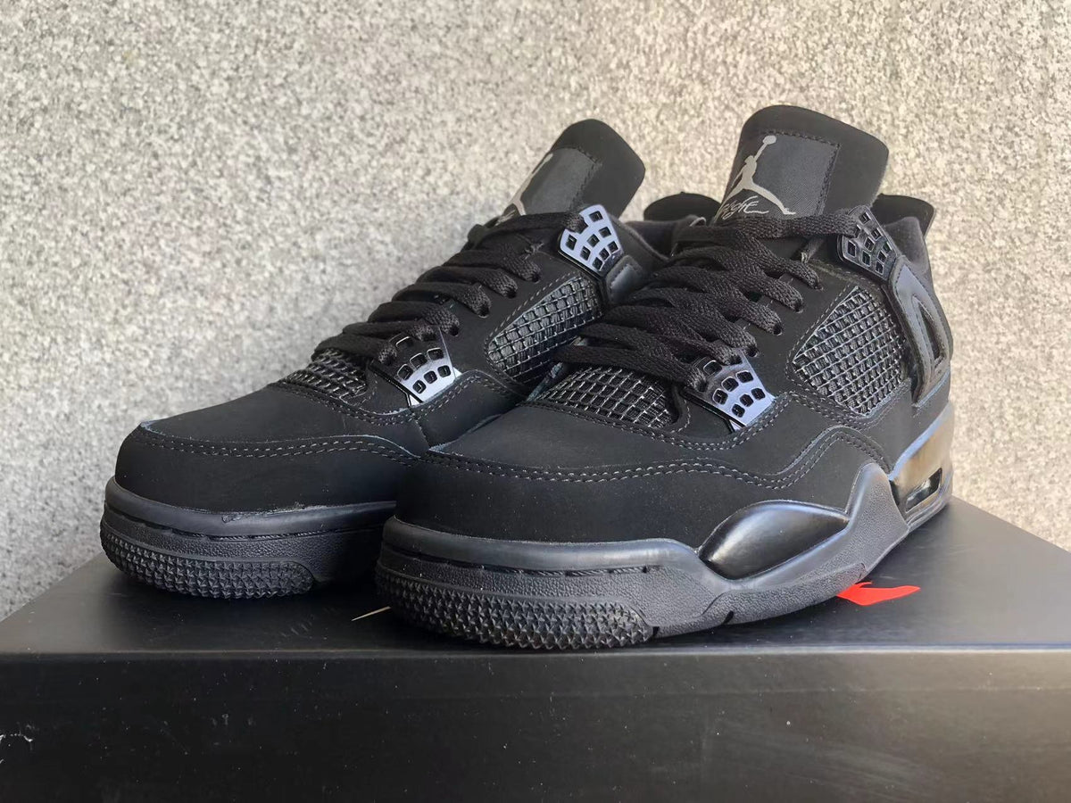 Jordan 4 Retro Black Cat Sneakers in Black - product image from the listing.