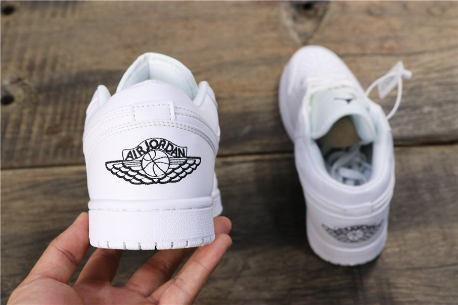 Nike Air Jordan 1 Low Sneakers in White 553560-101 - product image from the listing.