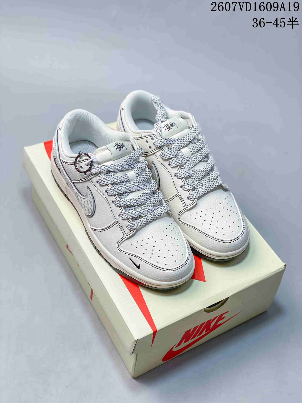 Nike Dunk Low Retro Custom Sneakers in White and Navy - product image from the listing.