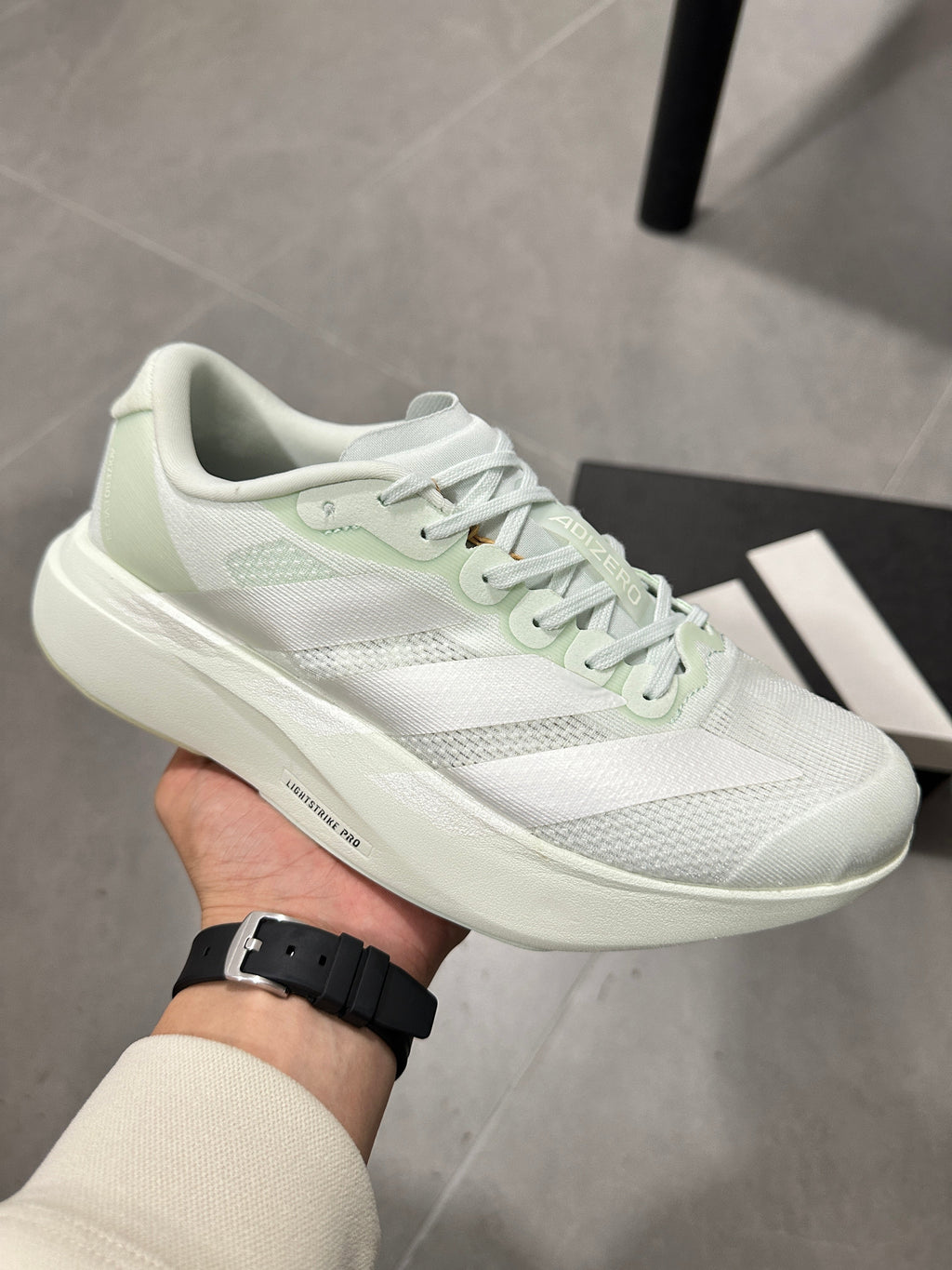 adidas Lightstrike Pro Running Shoes in White Green JR5840 - product image from the listing.