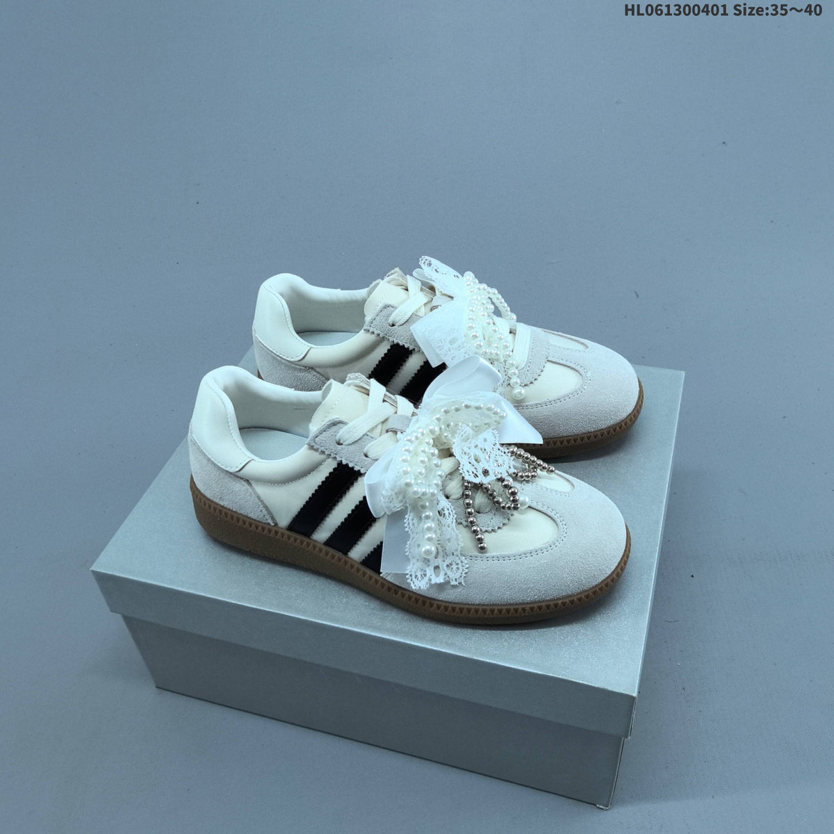 Ribbon and Pearl Bow Low-Cut Sneakers - product image from the listing.