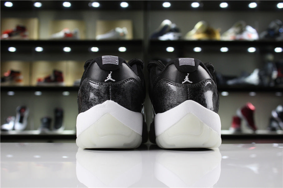 Jordan 11 Retro Low Barons Sneakers in Black White - product image from the listing.