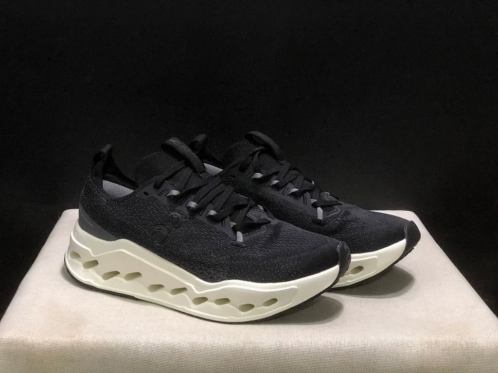 On Cloudsurfer Max Running Sneakers in Black and White - product image from the listing.
