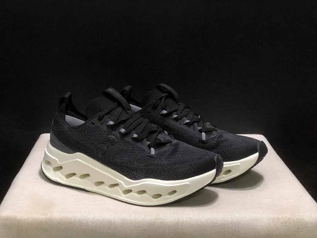 On Cloudsurfer Max Running Sneakers in Black and White - product image from the listing.