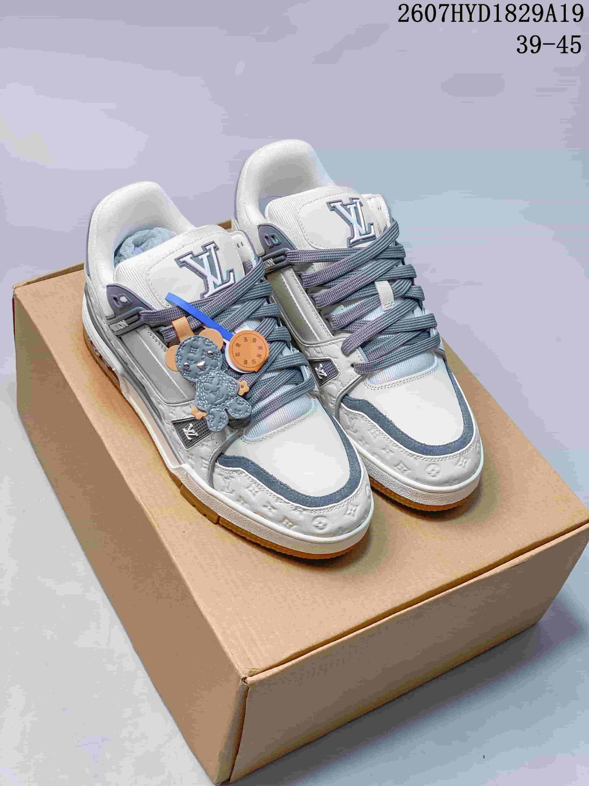 Louis Vuitton Trainer Maxi Low-Top Sneakers in White Gray - product image from the listing.