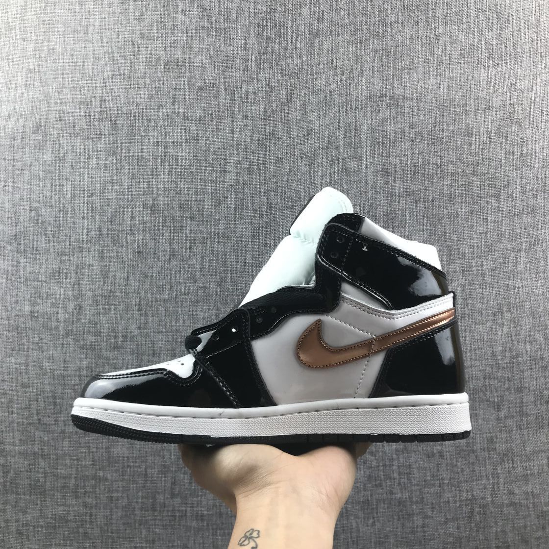 Air Jordan 1 Mid Sneakers in Black White Metallic Gold 852542-007 - product image from the listing.