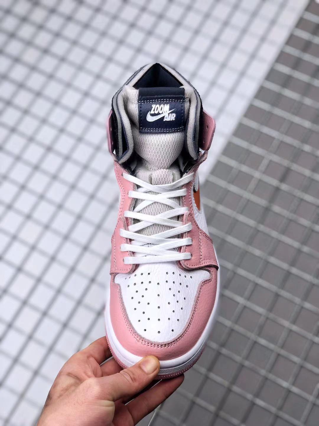 Jordan 1 High Zoom CMFT Sneakers in Pink White Orange CT0979-601 - product image from the listing.