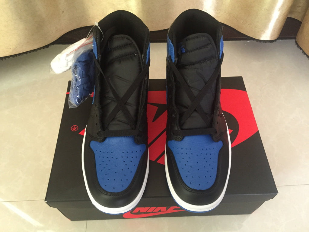 Jordan 1 High Sneakers in Black and Royal Blue - product image from the listing.