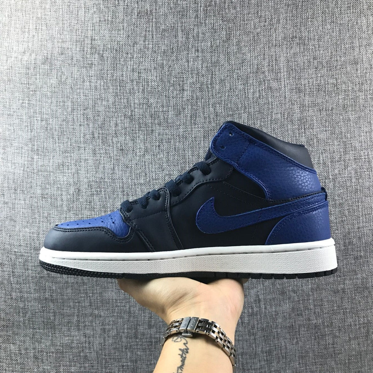 Air Jordan 1 Mid High-Top Sneakers in Black and Royal Blue - product image from the listing.