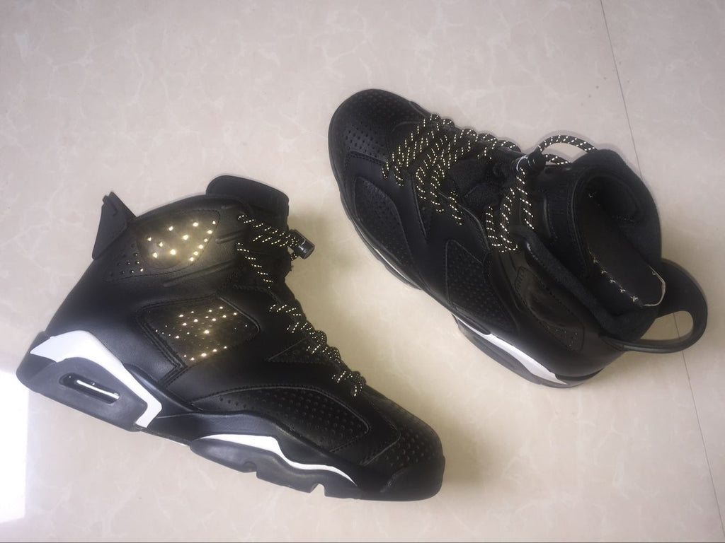 Jordan 6 Retro Black Cat High-Top Sneakers in Black and White - product image from the listing.
