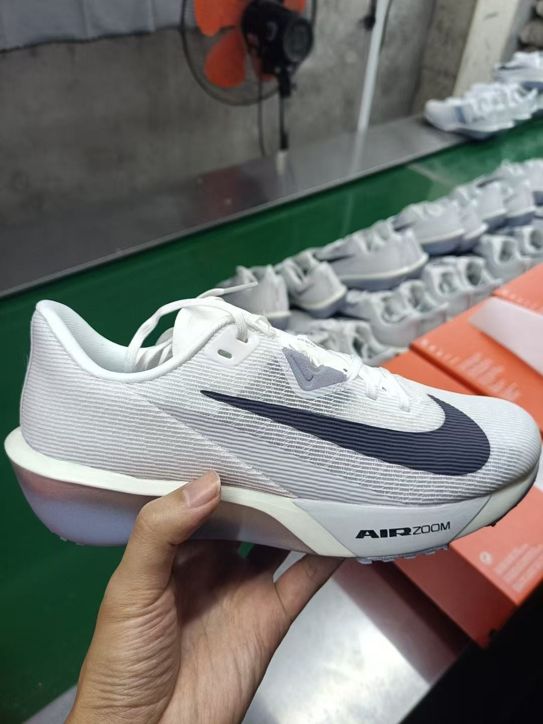 Nike Air Zoom Rival Fly 4 Running Shoes FV6040-102 in Gray White - product image from the listing.