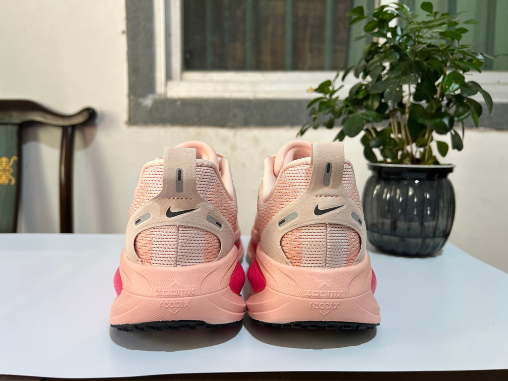 Nike Vomero 18 Running Shoes in Cream Pink - product image from the listing.