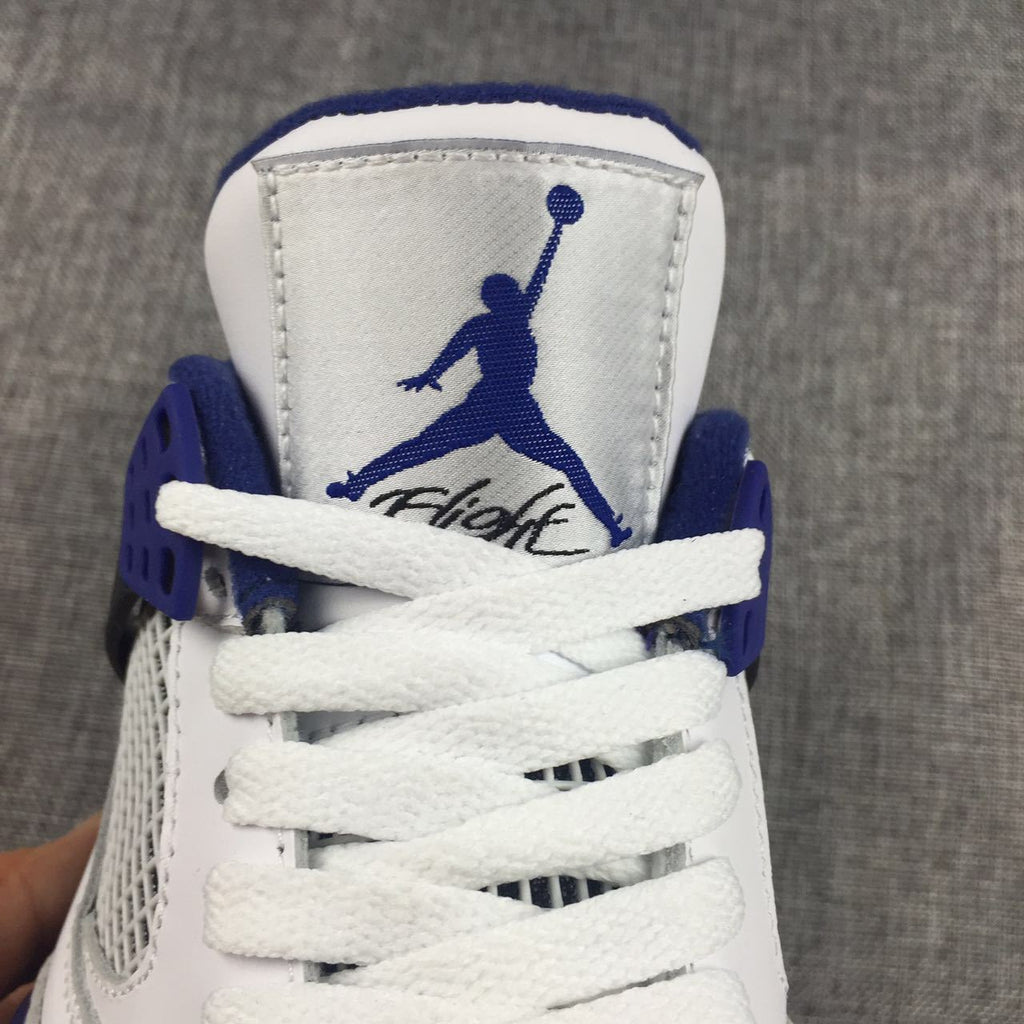 Air Jordan 4 Sneakers in White, Black and Blue - product image from the listing.