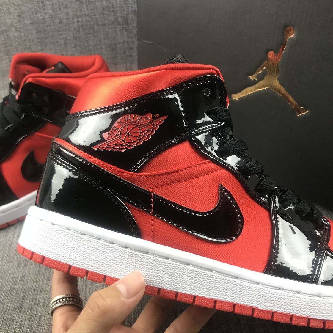 Air Jordan 1 Mid Sneakers in Black Red White BQ6472-600 - product image from the listing.