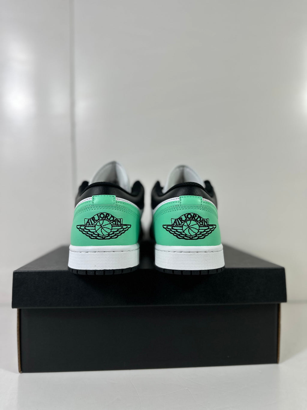 Air Jordan 1 Low White Green Black Sneakers 553558-131 - product image from the listing.
