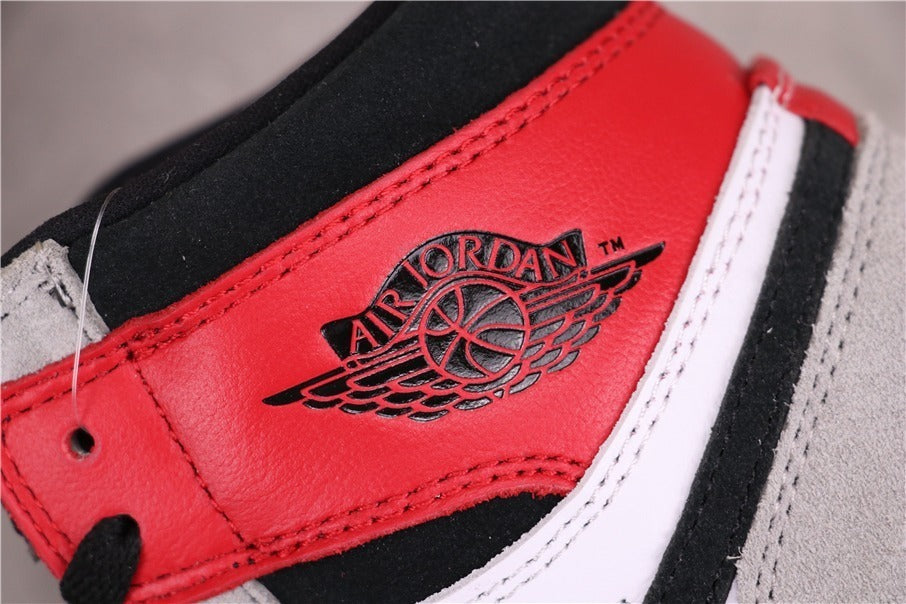 Air Jordan 1 High Sneakers in Light Smoke Grey 555088-126 - product image from the listing.