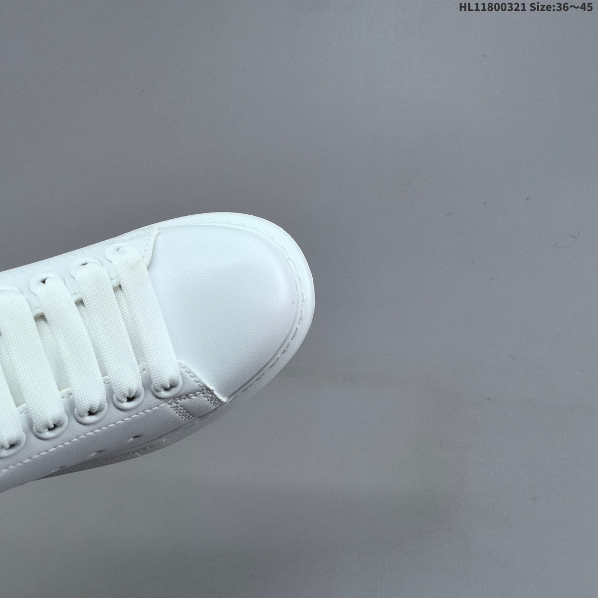 Alexander McQueen Oversized Low-Top Sneakers, in White and Blue - product image from the listing.