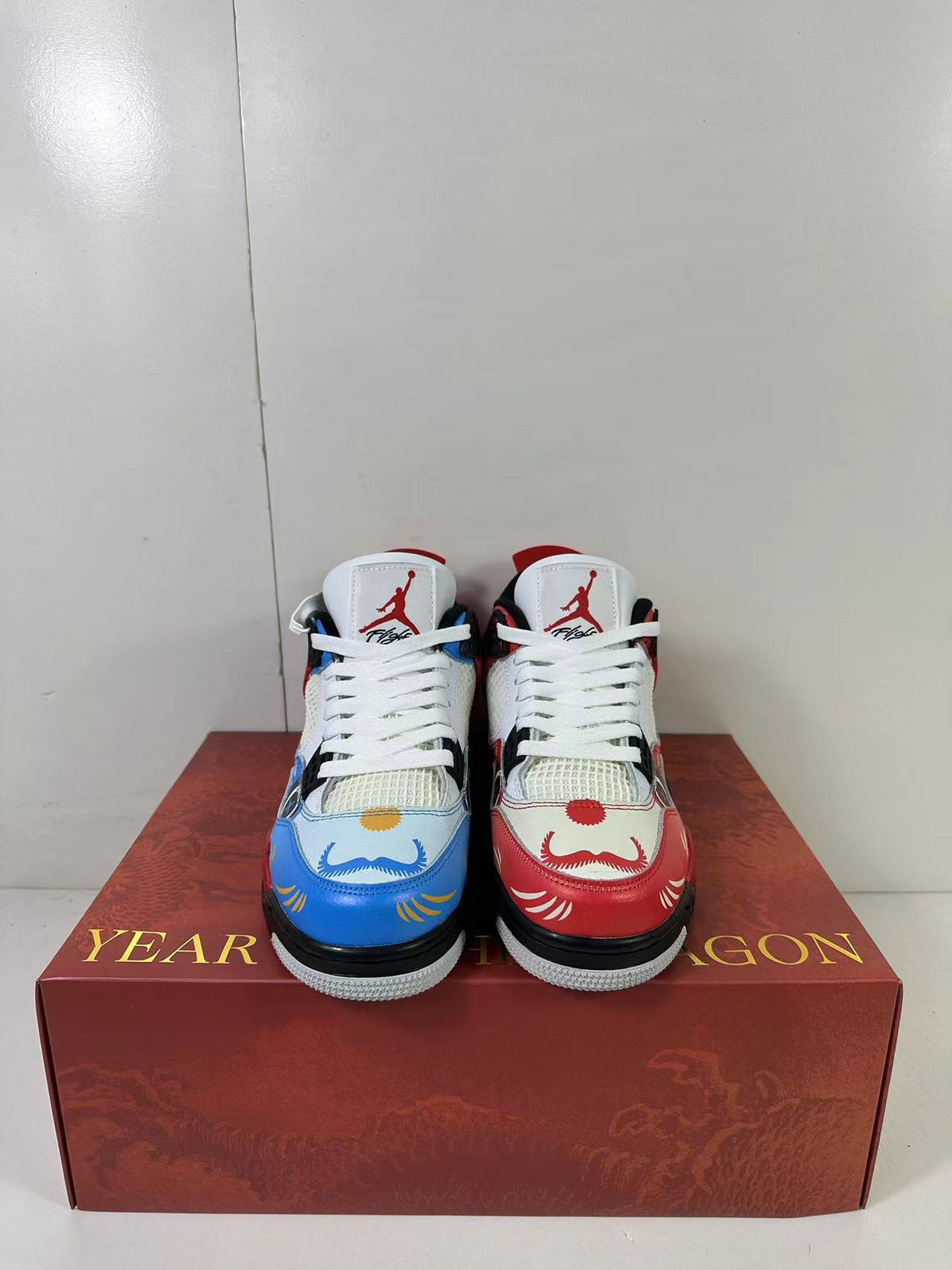 Air Jordan 4 Chinese New Year Red Blue Sneakers DH6927-161 - product image from the listing.