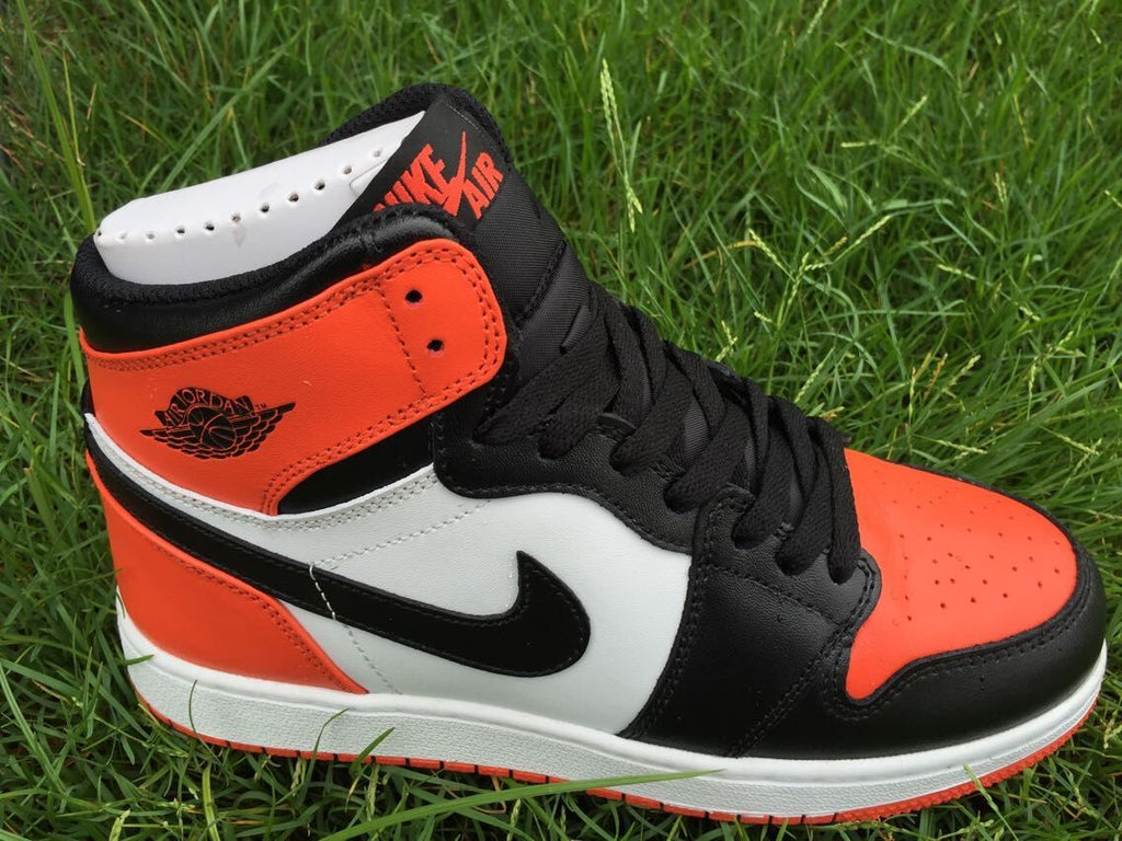 Women's Jordan 1 High Black Orange White Sneakers - product image from the listing.