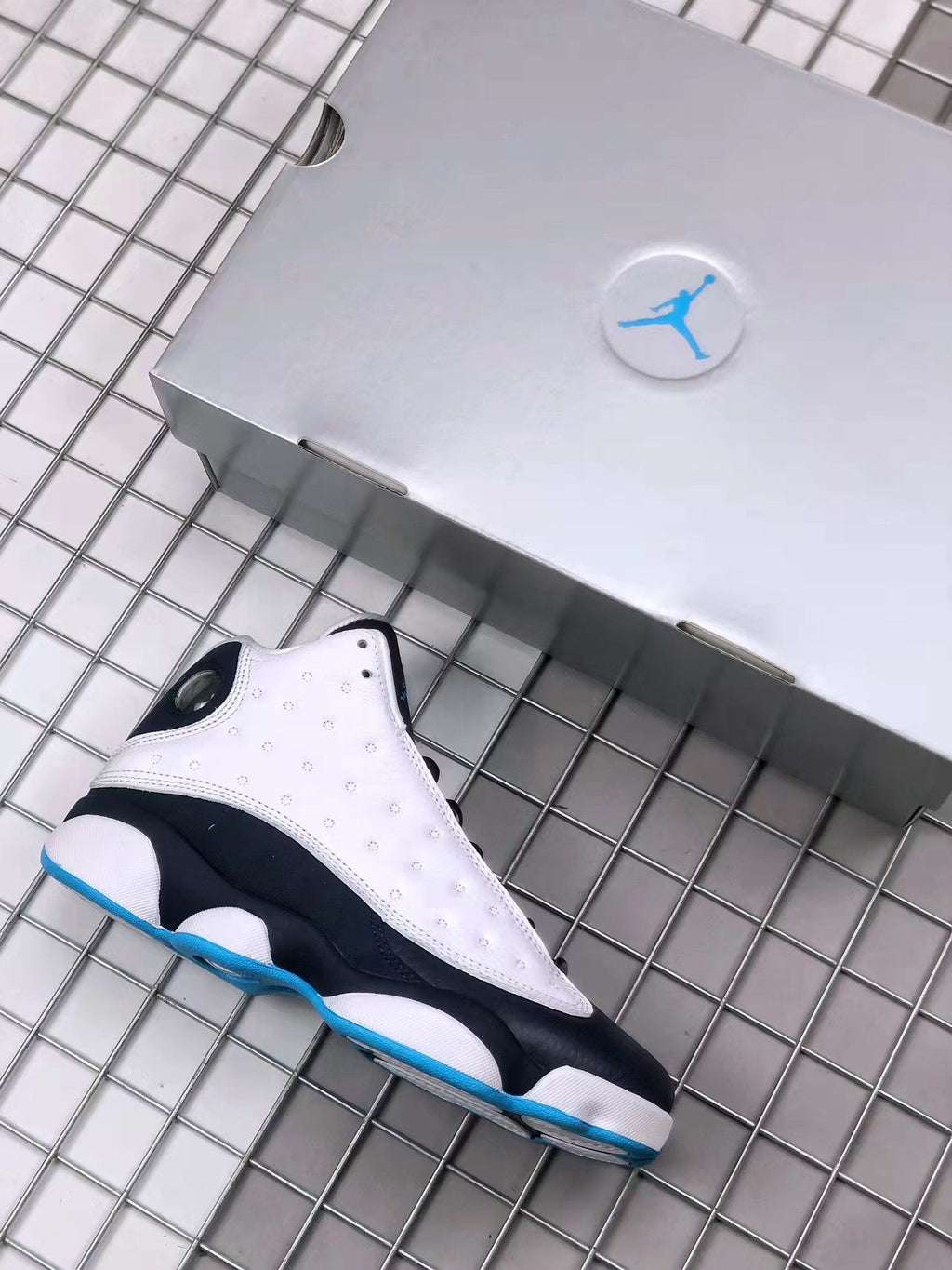 Air Jordan 13 Obsidian Sneakers 414571-144 - product image from the listing.