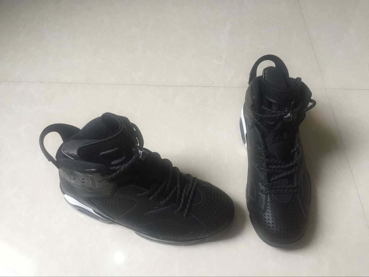 Jordan 6 Retro Black Cat High-Top Sneakers in Black and White - product image from the listing.