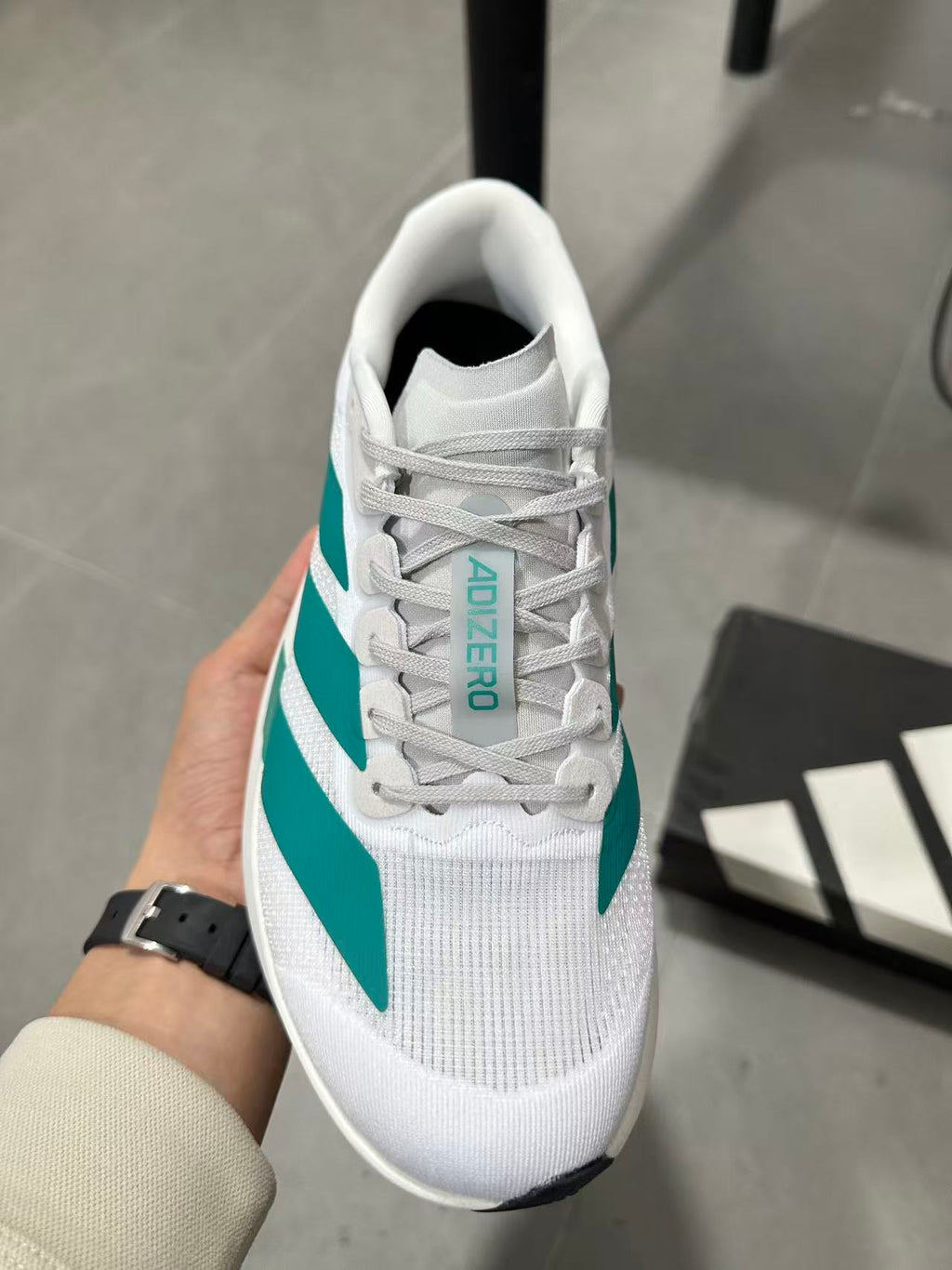 adidas Lightstrike Pro Running Shoes in White and Teal JR4451 - product image from the listing.