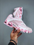 Nike Air Max Moto 2K Low-Top Running Shoes in Pink White - product image from the listing.