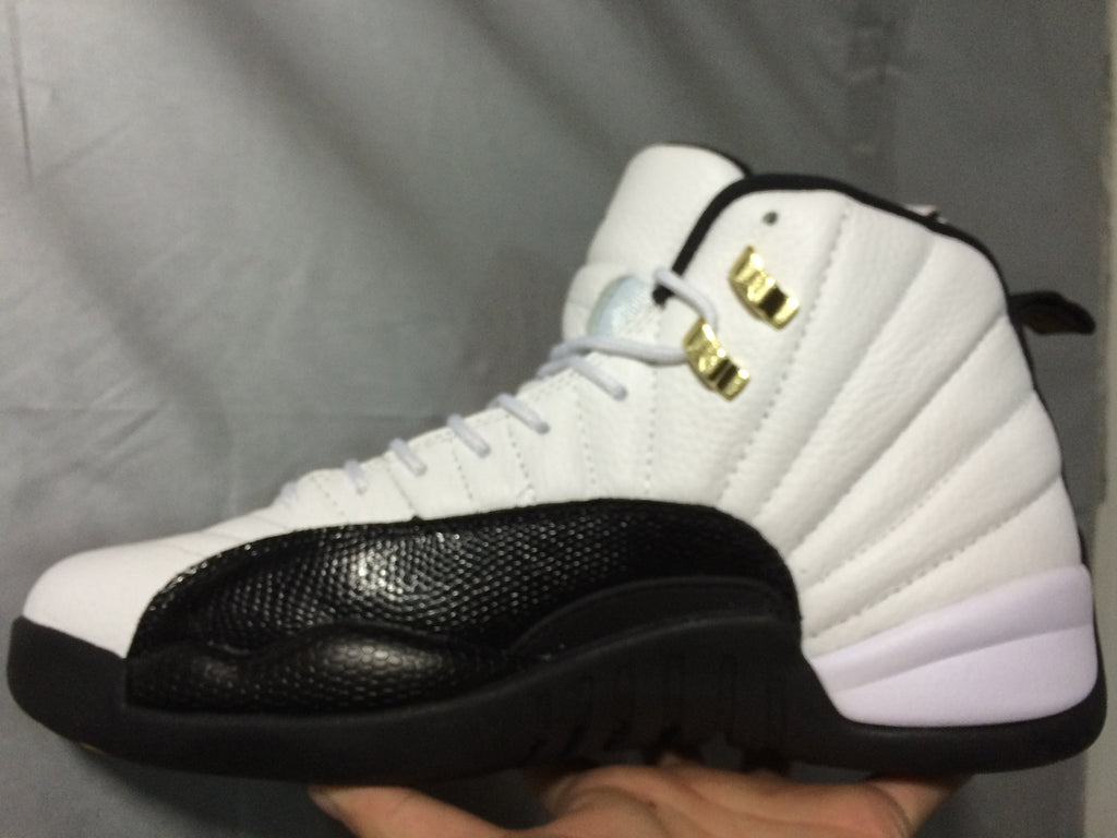 Air Jordan 12 Retro White and Black High-Top Sneakers - product image from the listing.