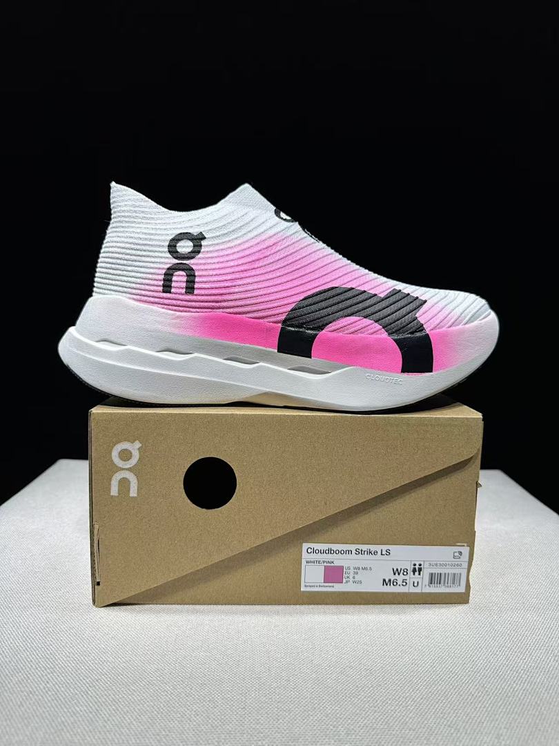 On Cloudboom Strike LS Running Sneakers in White/Pink - product image from the listing.